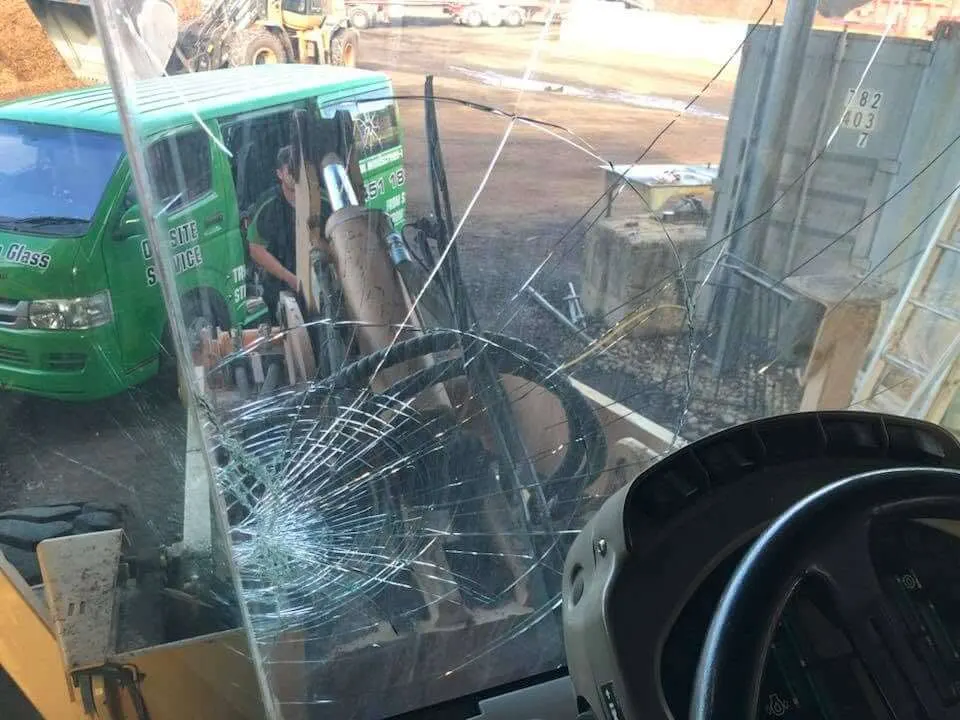 Cracked windscreen seen from inside the cab before replacement